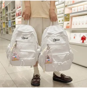 White student school backpack large capacity embossed floral casual daypack with cute pendant