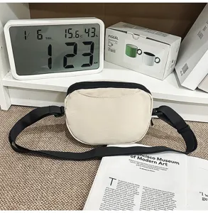 Casual canvas crossbody bag for men and women, small outdoor commuter shoulder phone bag.