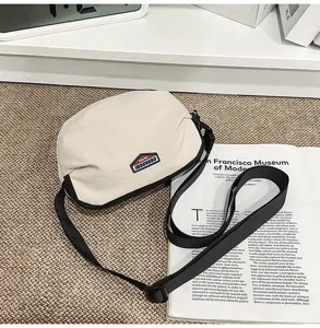 Casual canvas cross-body bag for men and women, stylish single shoulder commuter bag.