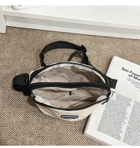 Outdoor small crossbody bag detail showing interior lining and zipper pocket design.
