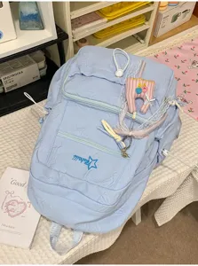 Light blue aesthetic backpack with cute star embroidery, large capacity school bag for daily use.