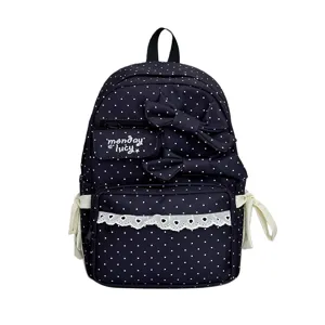 Navy blue polka dot canvas backpack with cute double bows and lace trim for school girls.