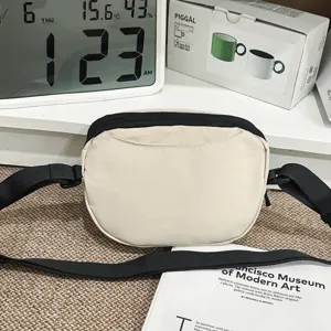 Casual outdoor small crossbody bag with adjustable black strap, minimal commuter sports style.