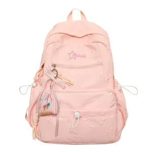 Pink casual school backpack for teenage girls with cute pendant and large storage capacity.