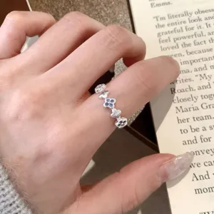 Silver clover flower open ring detail shot, dainty minimalist style finger jewelry for women.