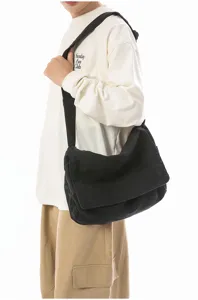 Casual black canvas messenger bag for daily wear, durable crossbody shoulder bag for men and women.