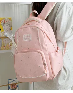 Pink star print school backpack with cute white lace trim for daily student casual use.