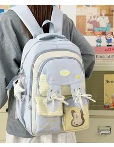 Cute bunny ear school backpack for girls, college style casual daypack with ribbon bows.