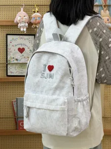 Casual grey canvas school backpack with embroidered heart design, comfortable straps and pockets.