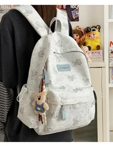 Cute bear tie-dye school bag, unisex commuter backpack with large capacity and stylish design.