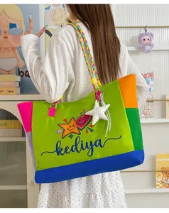 Colorblock canvas tote bag detail, vibrant green shoulder bag with colorful braided strap