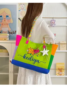 Colorful color-block canvas tote bag with braided strap and cute star pendant detail.