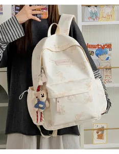 Cute tie-dye teddy bear backpack with plush pendant, large capacity casual commuting school bag.