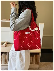 Red white polka dot canvas shoulder bag with pearl flower charm detail, casual daily fashion.