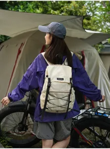 Outdoor camping scene detail view showing lightweight portable folding travel backpack.