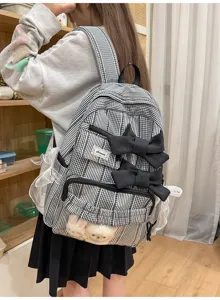 Black and white plaid backpack with cute bows, lace trim and clear front pocket design.