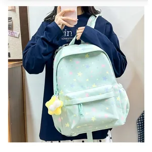 Ice blue star print school backpack with multi compartments and cute star pendant for students.