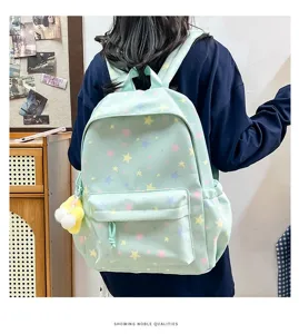 Ice blue star pattern canvas backpack casual school bag with cute pendant for daily commute.