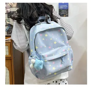 Light blue star pattern school backpack for student daily commute and casual outdoor activities.