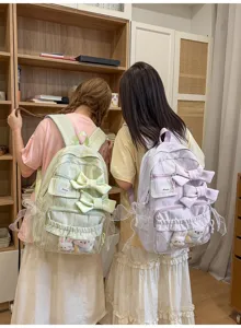 Sweet pastoral style school backpack featuring cute bows and plush rabbit details for daily travel.