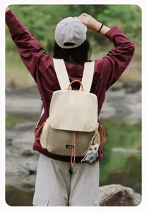 Casual canvas backpack with contrast colors and cute bear pendant for outdoor hiking daily use.