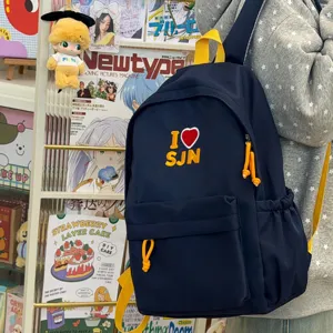 Navy blue student backpack with yellow straps and cute heart embroidery for daily casual travel use.