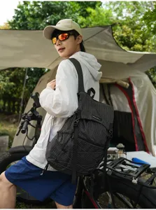 Detailed view of lightweight black grid outdoor backpack, perfect for hiking, camping and travel.