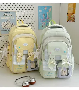 Cute pastel school backpack with bunny ears, ribbon bows and clear pocket for girls and teens.