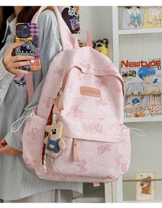 Pink tie-dye bear print backpack with cute plush pendant, casual student schoolbag.