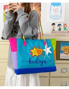 Details of colorful color-blocked dopamine canvas tote bag with braided straps and cute star print.