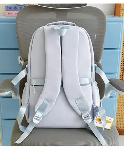 Detailed view of the light blue school backpack back strap design, clean and stylish daily bag.
