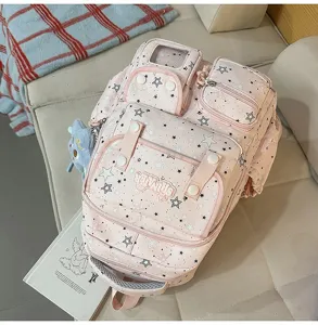 Pink star print multi-pocket school backpack with clear window pocket and cute plush pendant.