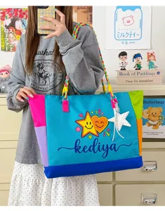 Colorful color block canvas tote bag with braided straps and star pendant for daily use.