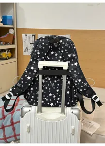 Black and white starry backpack with luggage strap, stylish student school bag for daily commute.