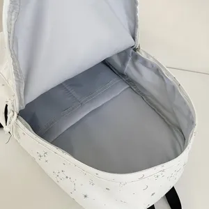 American college style white backpack with cute star and moon print for student daily use.