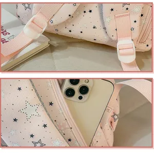 Pink star print schoolbag detail showing adjustable straps and zipper pocket, casual style.