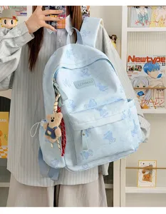 Cute tie-dye canvas backpack with bear pattern and adorable plush pendant for daily commute.