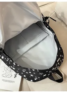 Black backpack with white stars, multi-compartment student schoolbag for daily commute and school use.
