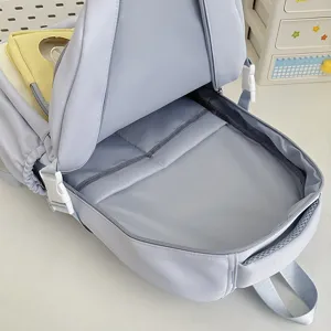 Light blue school backpack for girls, multi-compartment large capacity student bookbag.