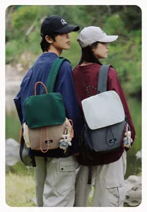 Casual couple backpack with flap and bear pendant, ideal for outdoor hiking and daily use.