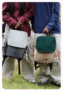 Outdoor casual couple backpack detail, contrast color flap drawstring design with cute bear.