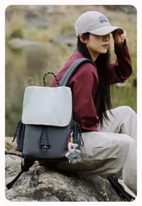 Grey canvas flap backpack with drawstring closure, perfect for outdoor hiking and daily casual use.