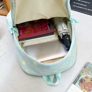 Pastel blue star print backpack with multi compartments, perfect for school and daily commute.
