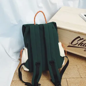 Casual green canvas backpack with orange handle and side pockets for outdoor hiking travel.