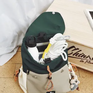 Casual outdoor dual-tone backpack with spacious main compartment, durable fabric for daily use.
