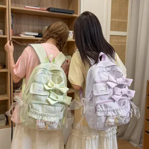 Sweet pastoral style plaid backpack with large bow and cute plush doll for daily travel.
