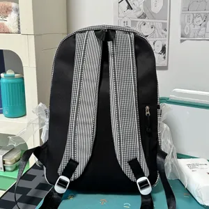 Black canvas student backpack with plaid straps and lace ribbon trim casual daypack