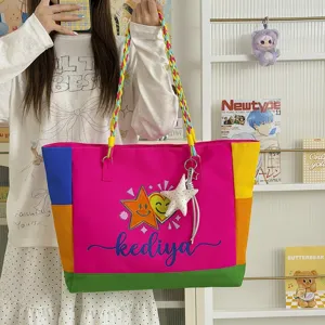 Colorful color-blocked canvas tote bag with braided straps and star pendant for casual daily use.