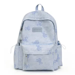 Light blue tie-dye backpack with cute bear print, spacious casual daypack for daily commute.