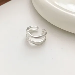 Minimalist matte irregular multi-layer open ring detail shot showing smooth texture.